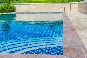 Beautifully tiled swimming pool.